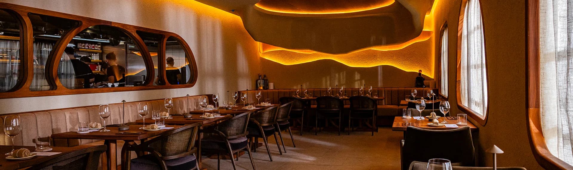 Terra dining room with wooden interior and warm lighting