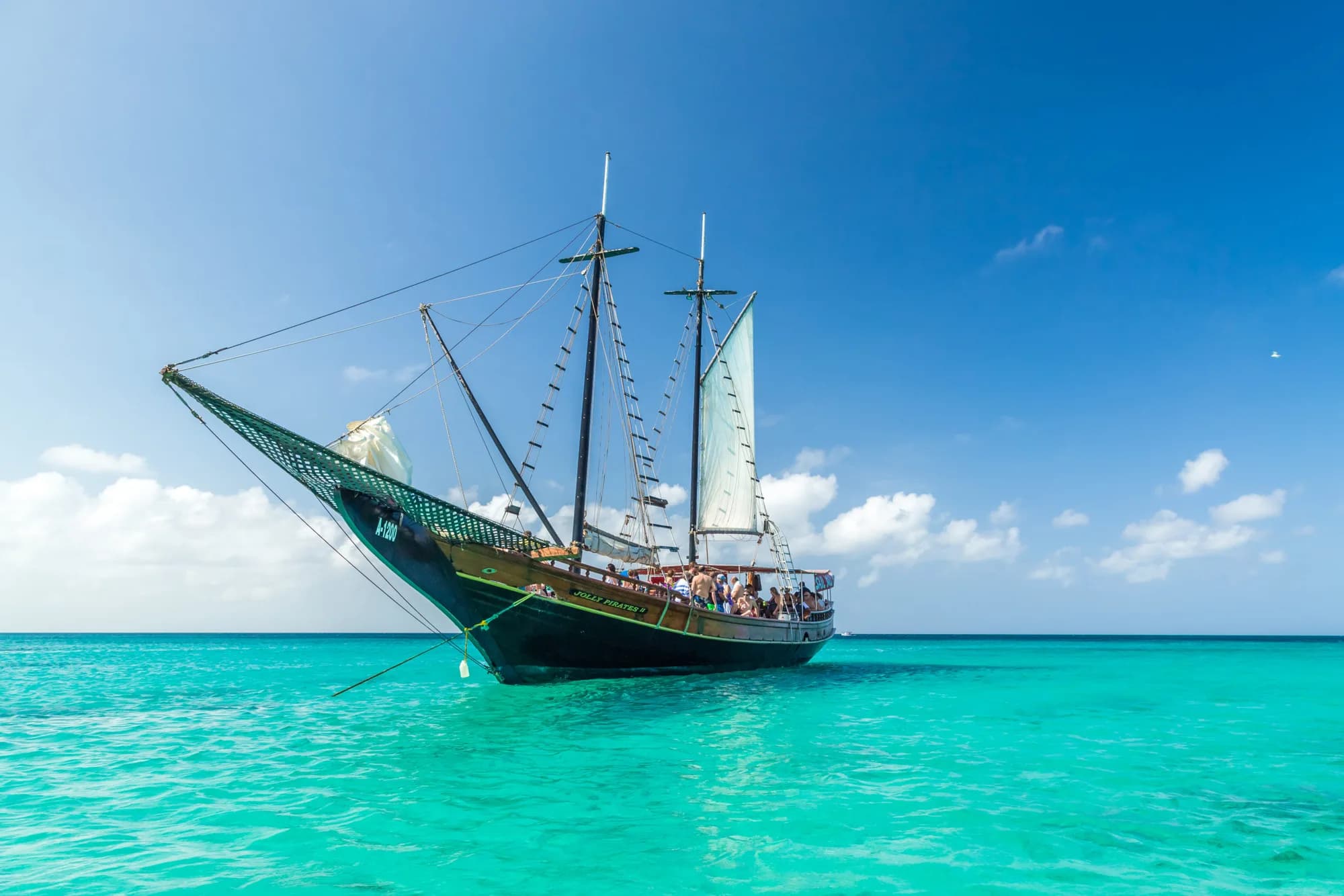 Pirate schooner under sail on turquoise water