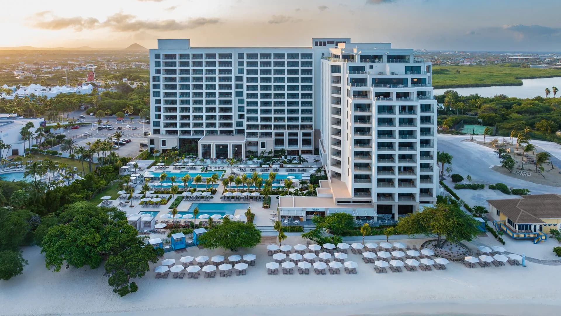 Aerial view of resort, pools and beach